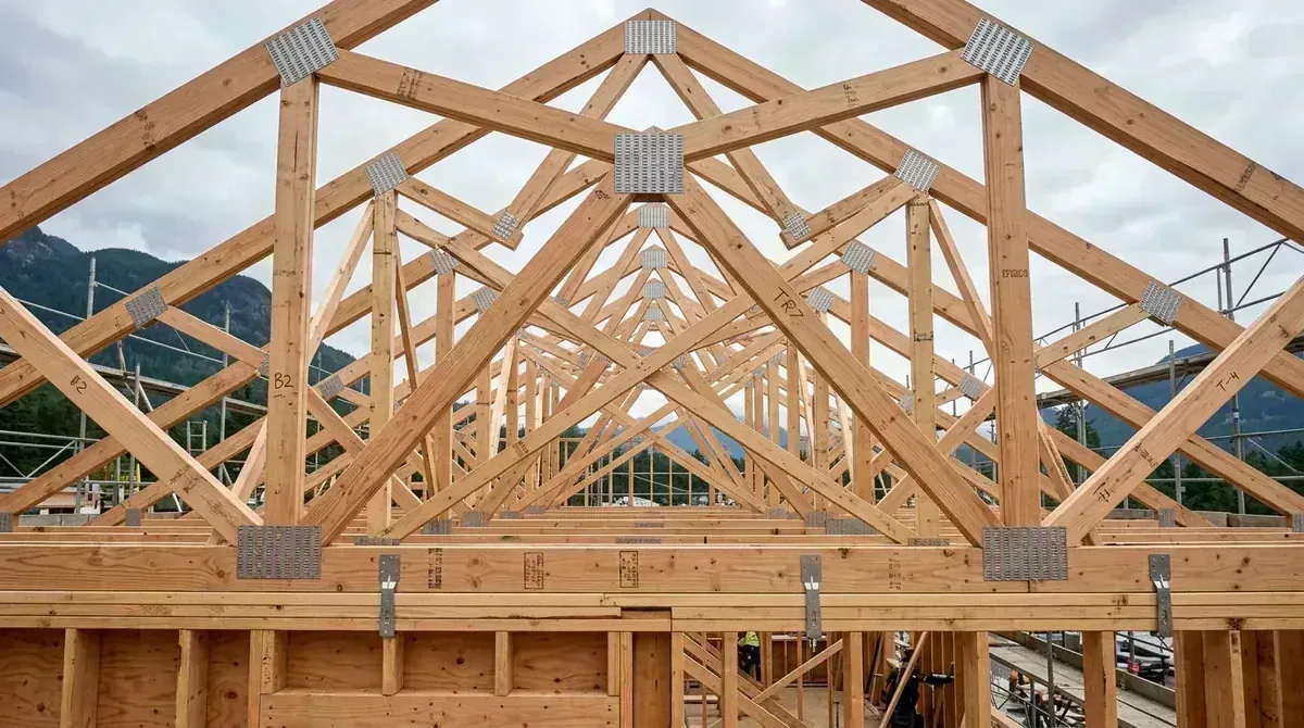Engineered wood roof trusses on active BC residential construction site
