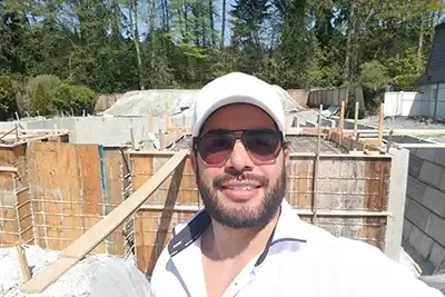 Edward Vega reviewing custom home drawings