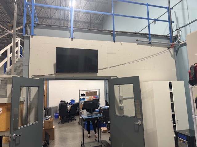 Under-deck structural steel columns, joists, and underside clearances for commercial mezzanine