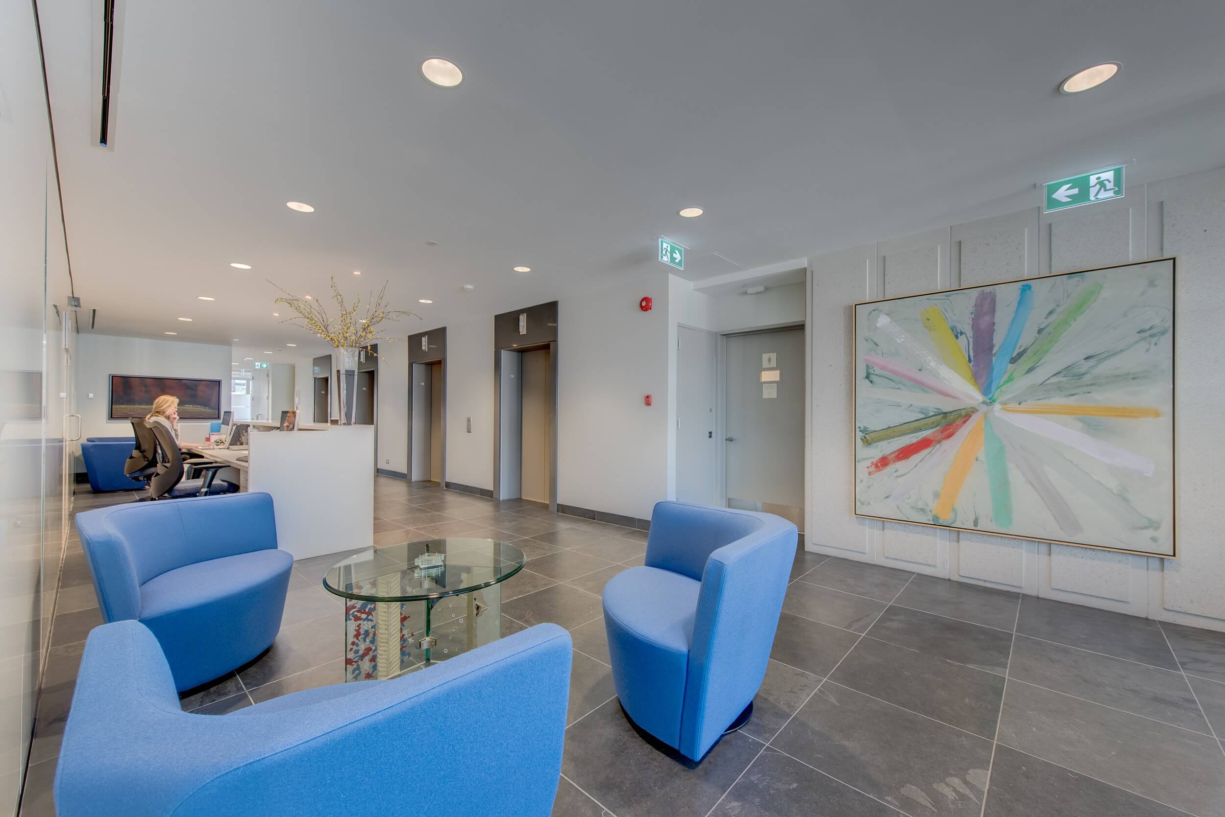 Modern open-plan office layout with modular workstations, ergonomic daylighting, and dropped ceiling grids